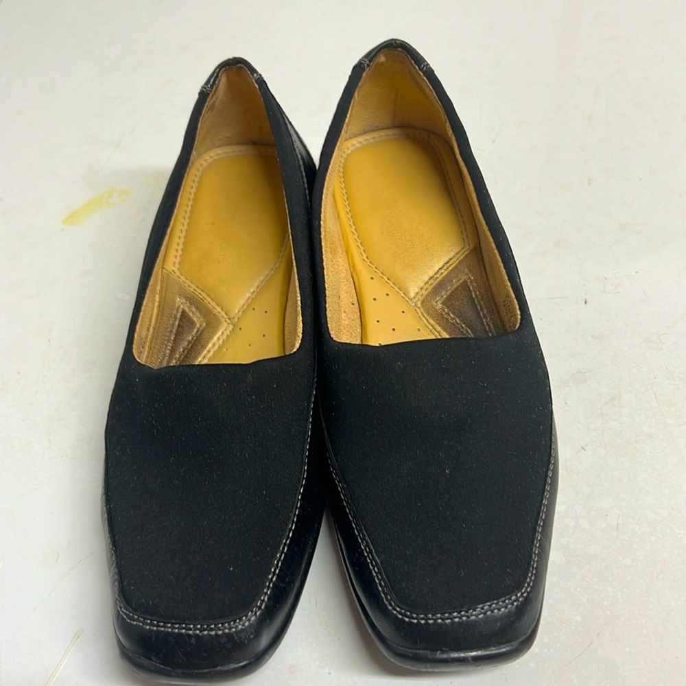 Naturalized Black Slip-ons